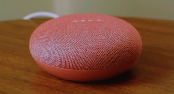 The Google Home Mini, in coral