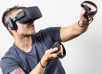 This gamer is decked out in full Oculus Rift VR gear.