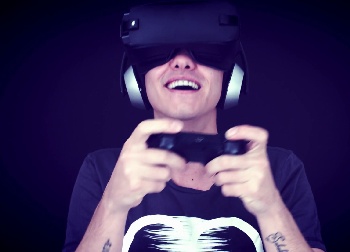 Man amazed by virtual reality goggles.