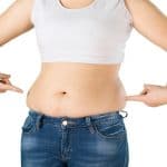 Muffin top above jeans